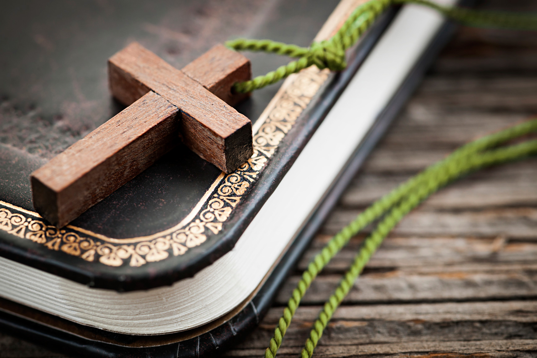 cross on bible green